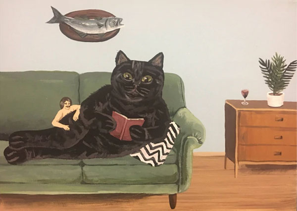 cat on couch reading art